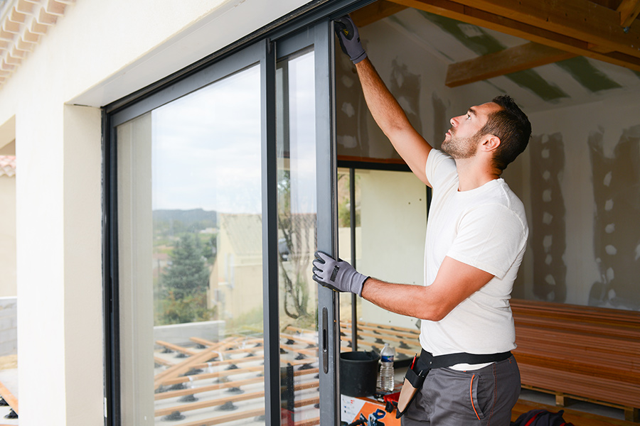 contractor-installing-new-sliding-windows-at-bedroom-shreveport-la